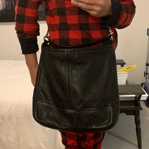 COACH black leather crossbody bag.